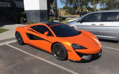 Vehicle Application - orange Lamborghini outside tint shop